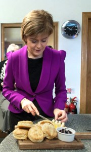 Nicola Sturgeon buttering a scone
