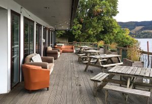 Picture of the outside seating area at Venachar Lochside overlooking the loch