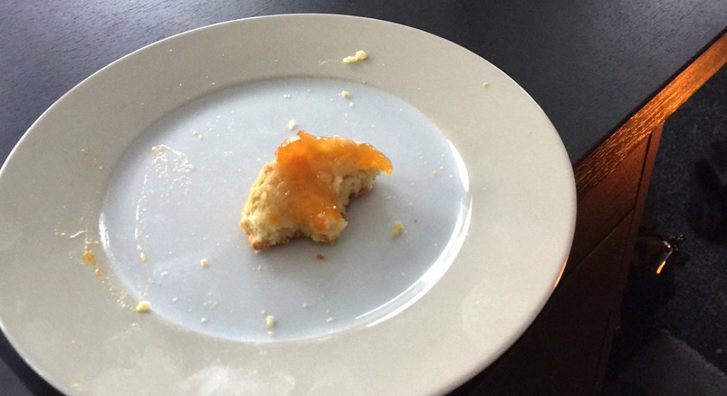 What's left of a scone and apricot jam