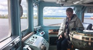 Pat in the captain's chair on HRY Britannia