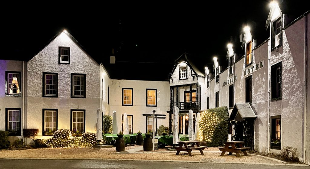 External view of the Moulin Hotel at night